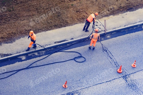 Preview: Workers With A Jackhammer Clean The Asphalt On The Sidewalk