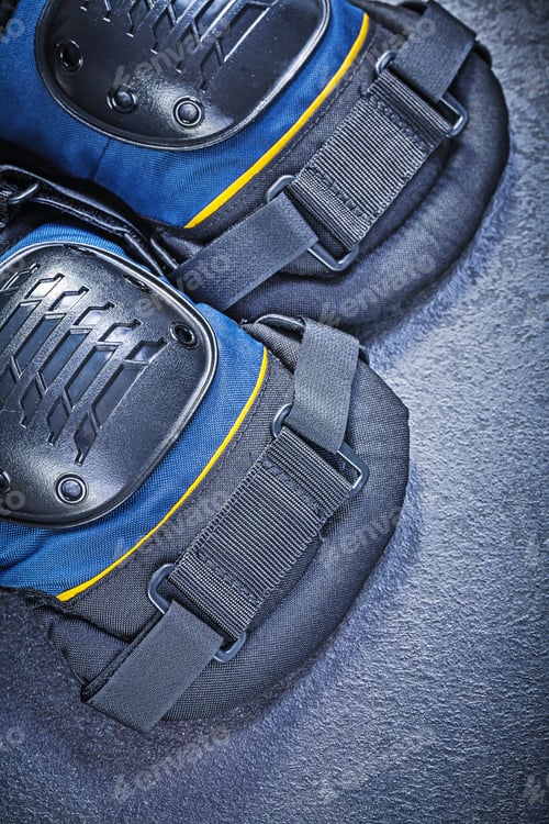 Preview: Knee Protectors On Black Background Top View Construction Concept.
