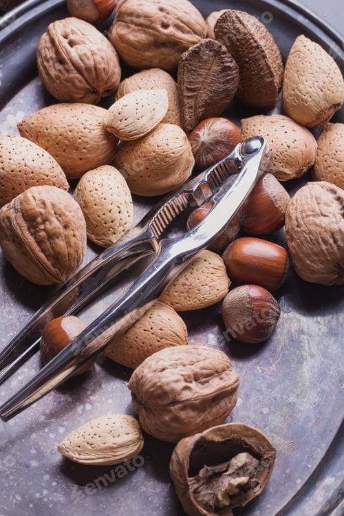 Preview: Selection Of Various Nuts: Almonds, Brazilian, Walnuts On A Vintage Oval Metal Tray, Black