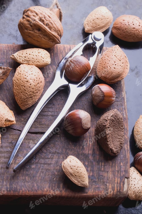 Preview: Selection Of Various Nuts: Almonds, Brazilian, Walnuts On Tiny Vintage Wooden Board, Black