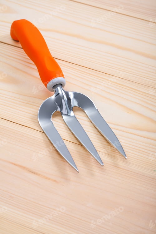 Preview: Gardening Tool Small Hand Fork On Wooden Boards