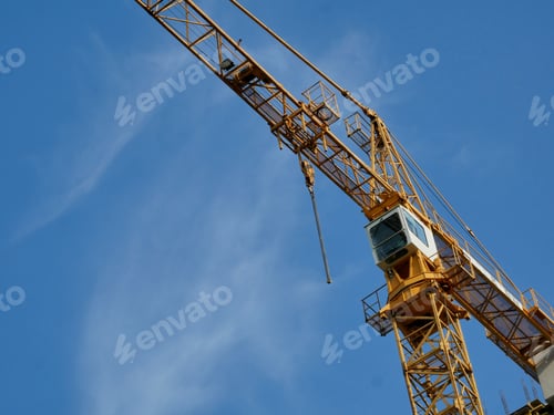 Preview: High-Rise Construction Crane Against The Blue Sky