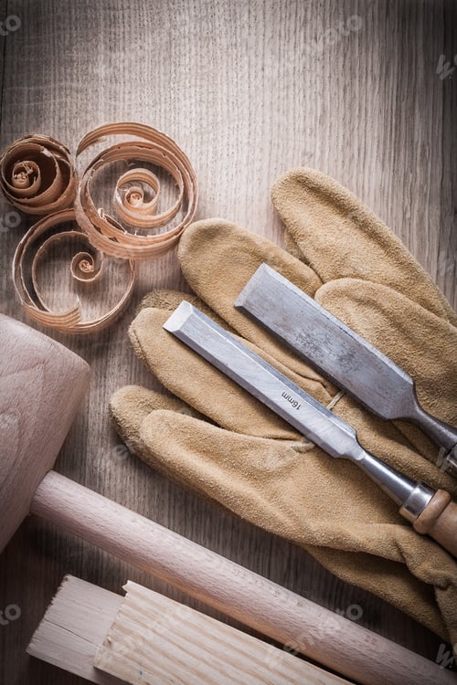 Preview: Wooden Planks Hammer Curled Up Shavings Firmer Chisels Leather Gloves On Wood Board Construction