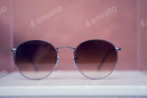 Preview: Round Sunglasses In Silver Metal Frames Close Up On A Store Shelf
