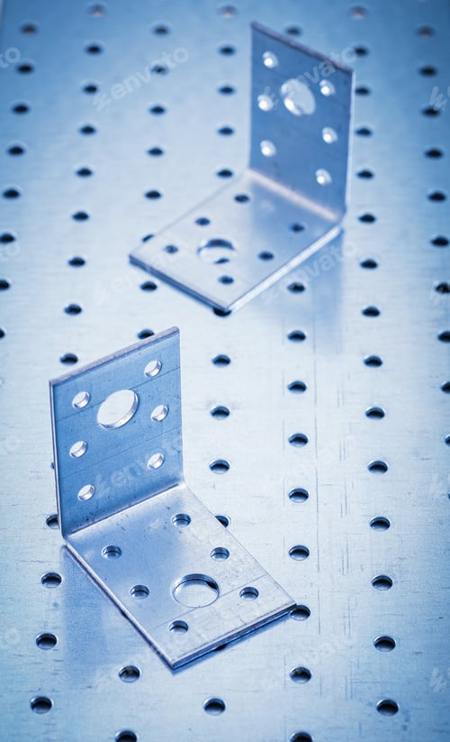 Preview: Stainless Perforated Angle Fasteners On Metallic Background Construction Concept.