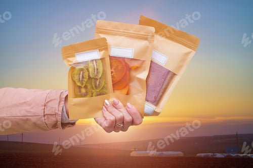 Preview: Dried Fruits Packaged In Eco-Friendly Paper Bags In Hand. Pastila, Persimmon And Kiwi. Healthy