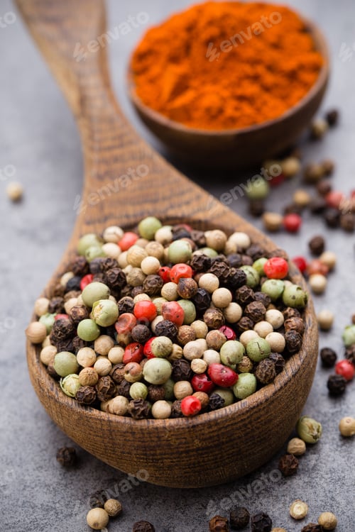 Preview: Peppercorn Mix In A Wooden Bowl On Grey Table.