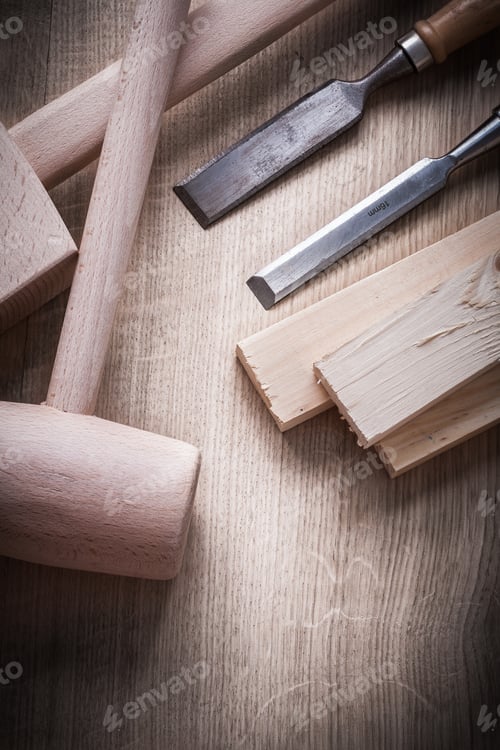 Preview: Wooden Building Boards Hammers Flat Chisels On Wood Background Construction Concept.