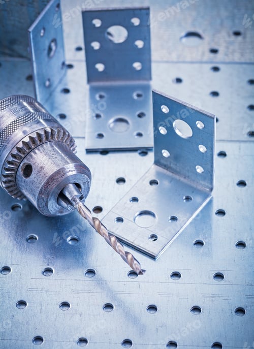 Preview: Stainless Drilled Angle Fasteners And Metal Drill On Perforated Metallic Sheet Construction Concept.