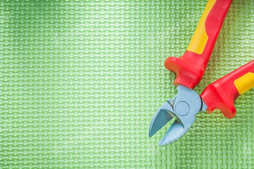 Preview: Sharp Insulation Nippers On Green Background Electricity Concept.