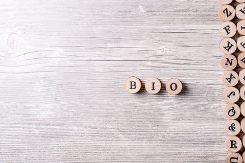 Preview: Word Bio Made From Wooden Letters Over Gray Wooden Background. Top View, Flat Lay. Copy Space