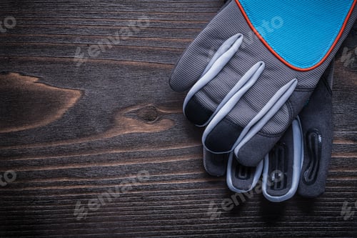 Preview: Pair Of Protective Gardening Gloves On Wooden Board Agriculture Concept.
