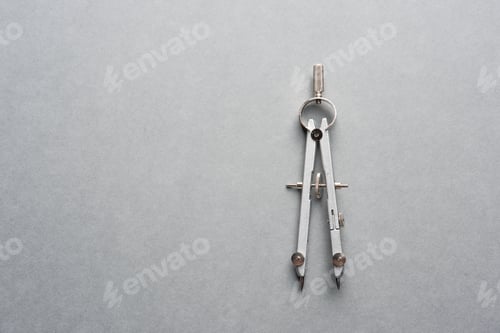 Preview: A Metal Compass On Grey Background