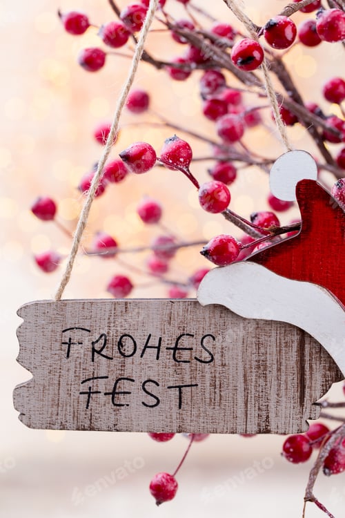 Preview: Christmas Cone With Red Berries On A Bokeh Background.