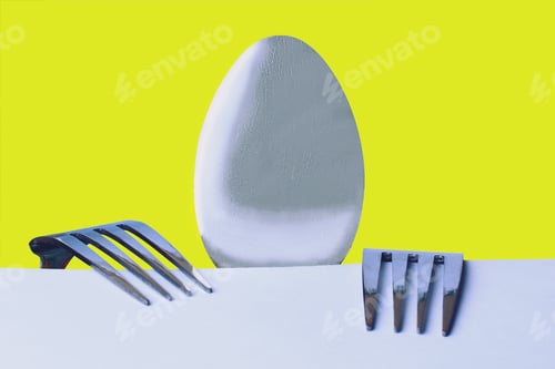 Preview: A Spoon And Two Forks On A Yellow Background Metaphorically Depict A Hungry Man Sitting At A Table