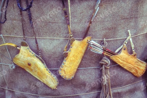 Preview: Quivers With Vintage Bows Hanging On The Wall Of The Yurt Buryats (Russia). Weapons For Hunting And