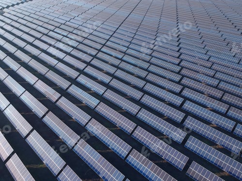 Preview: Aerial Photo Of Solar Power Plant. Many Solar Energy Panels In Countryside From Above.
