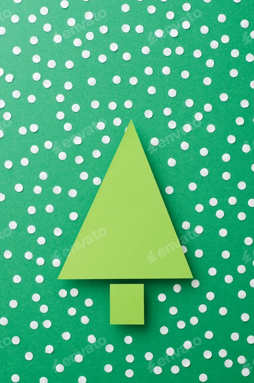 Preview: Paper Christmas Tree And Snow Cut From Green Paper Over Green Background,Top View