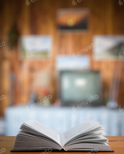Preview: Open Book On Old Vintage Wooden Table In The Living Room