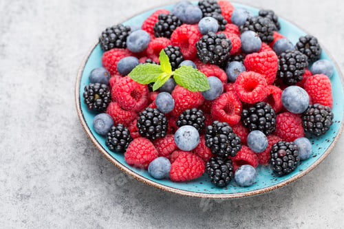 Preview: Fresh Berries In A Plate On A Wooden Background. Flat Lay, Top View, Copy Space.