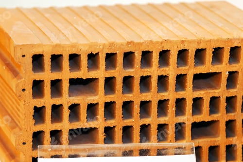 Preview: Detail Of Orange Hollow Clay Block On A Stand At Construction Fair