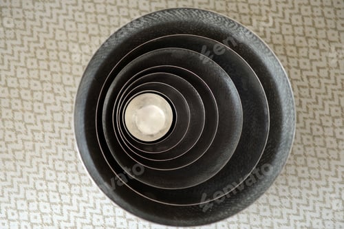 Preview: Stack Of Metal Bowls And Cups Inside