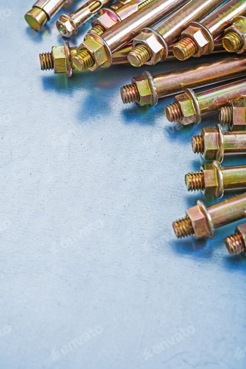 Preview: Vertical Version Of Anchor Bolts For Concrete Walls And Construction Nuts On Metallic Background