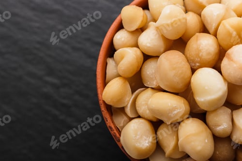 Preview: Delicious Macadamia Nuts On A Dark Stone Background
