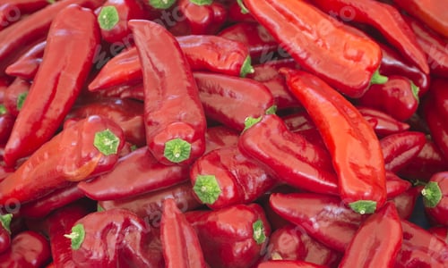 Preview: Heap Of Ripe Big Red Peppers At A Street. A Special Variety Of Red Peppers. (Selective Focus)