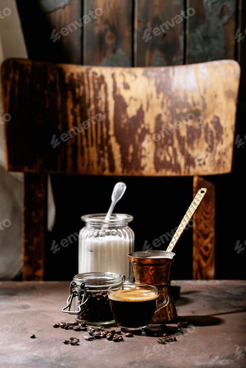 Preview: Fresh Coffee In Glass Cup With Sugar And Coffee Beans Over Brown Wooden Background. Top View, Flat