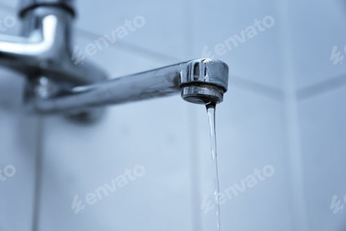 Preview: Water Pouring From Tap, Closeup. Water Saving Concept