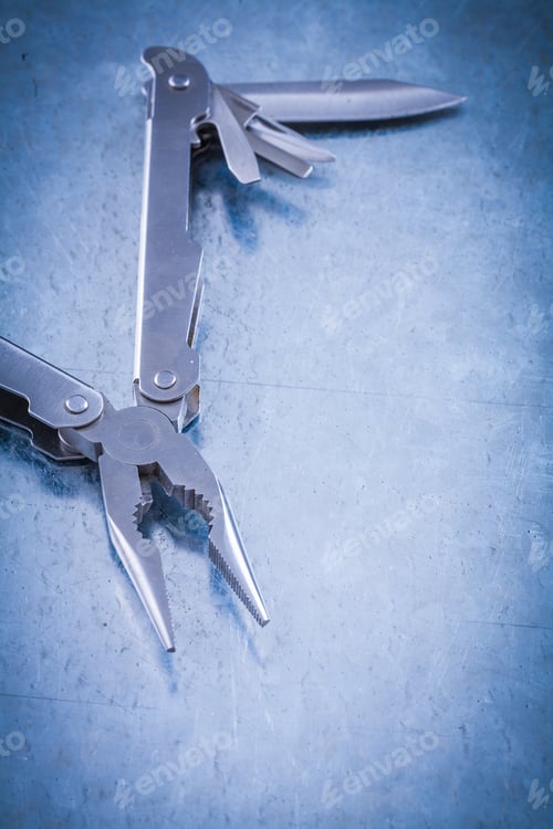 Preview: Muunctional Stainless Jackknife On Scratched Metallic Background Construction Concept.