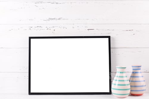 Preview: Empty Black Frame Mockup And Vases With Copy Space Near By Wooden Textured White Wall.