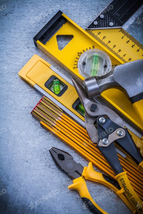 Preview: Set Of Construction Tools On Scratched Metallic Background.
