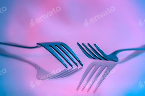 Preview: View Of Two Forks With Reflection And A Colorful Background