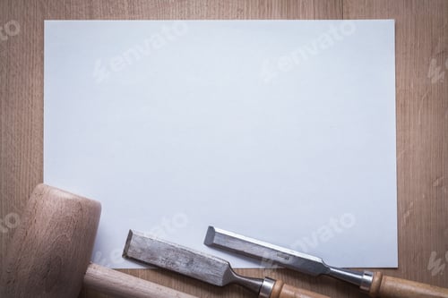 Preview: Flat Chisels Wooden Mallet And Clean Sheet Of Paper On Wood Board Copyspace Construction Concept.