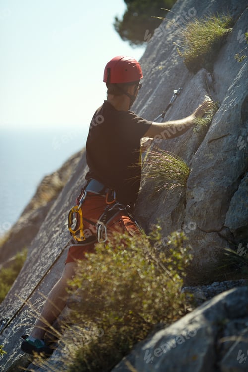 Preview: The Figure Of A Climber On A Steep Rocky Section During The Competition In Sunny Weather.