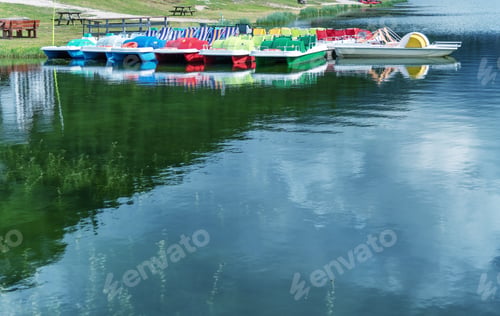 Preview: Colorful Pedalos On A Mountain Lake With Reflections. Copy Space