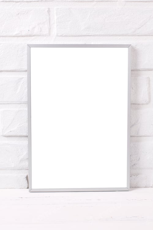 Preview: Empty Moderm Silver Frame Mockup With Copy Space Near By Brick White Wall. Portrait Orientation.