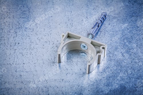 Preview: Plastic Pipe Clamp On Metallic Background Top View Construction Concept.