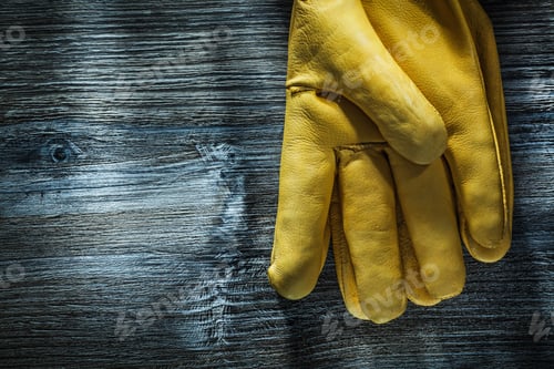 Preview: Pair Of Safety Gloves On Wooden Board.