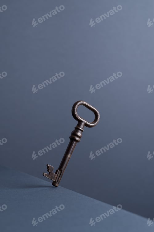 Preview: Vintage Key In Balance At The Edge Of The Table