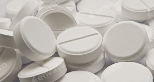 Pile of White Round Pills Close Up