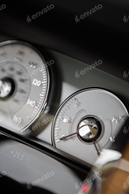 Preview: Close Up Shot Of A Car'S Dashboard With The Fuel Gauge.