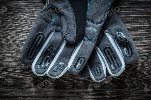 Preview: Pair Of Safety Gloves On Wooden Board.