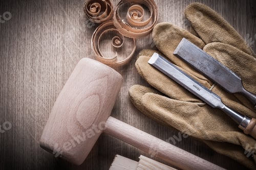 Preview: Wooden Bricks Hammer Curled Up Planning Chips Firmer Chisels Leather Gloves On Wood Board