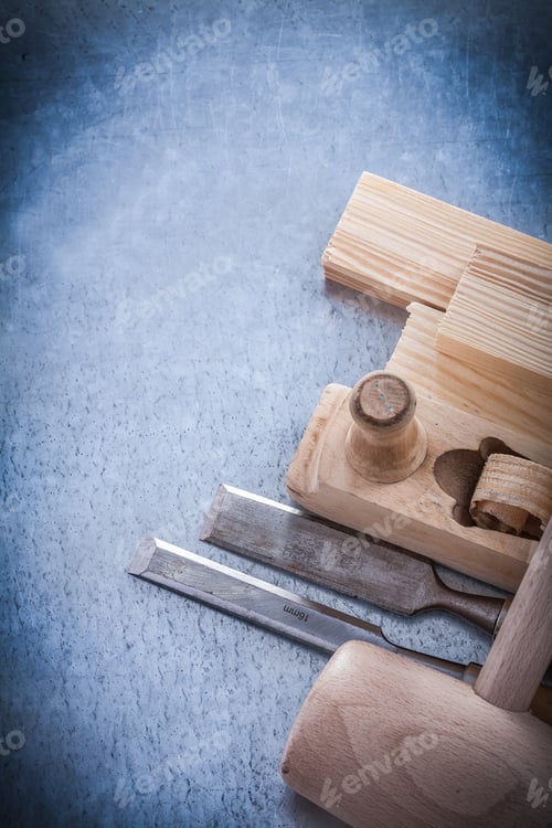 Preview: Wooden Shaving Plane Hammer Stud Flat Chisels On Metallic Background.