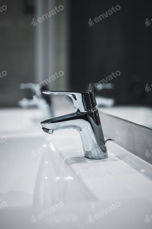 Preview: White Ceramic Washbasin In Bathroom. Water Battery Detail.