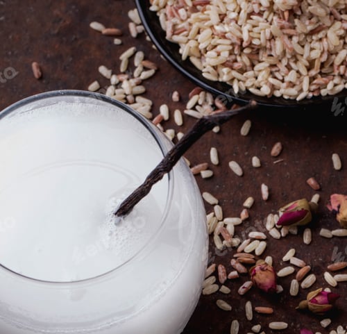 Preview: A Glass Of Home Made Rice Milk Served With Brown Rice, Honey And Organic Sugar Candies On A Rustic