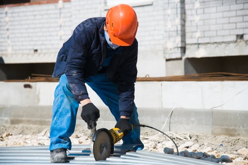 Preview: The Builder Uses An Electric Grinding Machine To Cut The Profiled Flooring